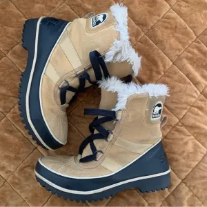 Sorel tan and black furry short snow boots size 7