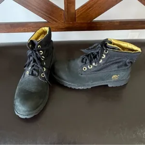 Timberland boots in a size 5 black and gold